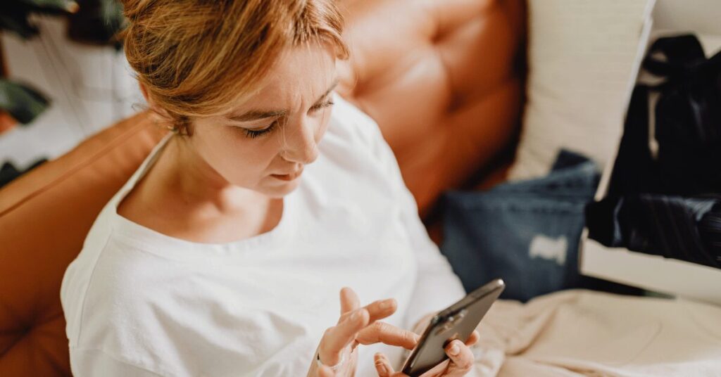 woman scrolling on phone